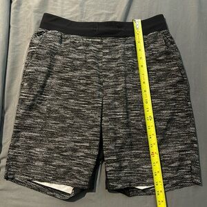 Black and white lululemon athletic shorts. Size M. No liner
